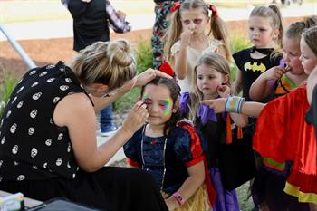 Children lining up to get their face painted