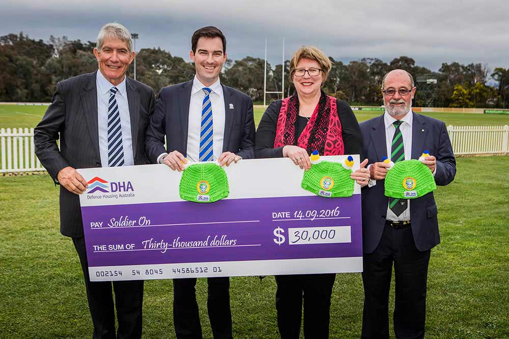 Soldier-On DHA Chairman, the Hon J.A.L. (Sandy) presents Soldier On CEO John Bale with a cheque for $30,000